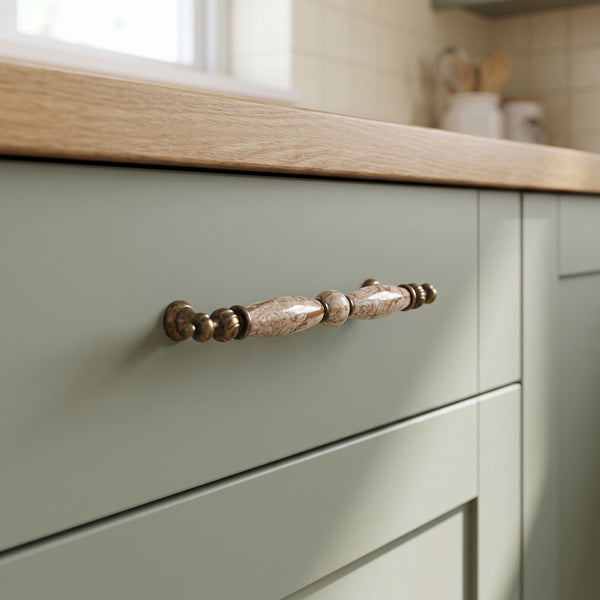 Elara Slender Bar Handle in BROWN+AB, 160mm, fitted on a kitchen drawer