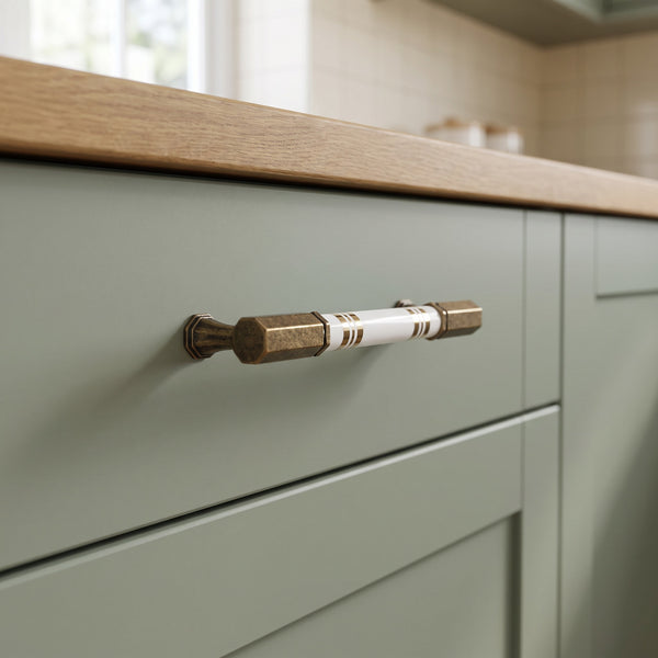 Orbis Globe Bar Handle in Antique, 128mm, fitted on a kitchen drawer
