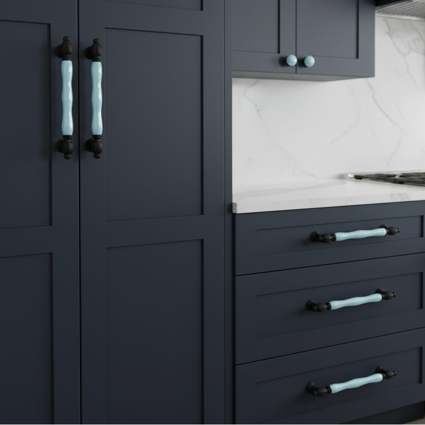dark blue cabinets with blue ceramic handles. 