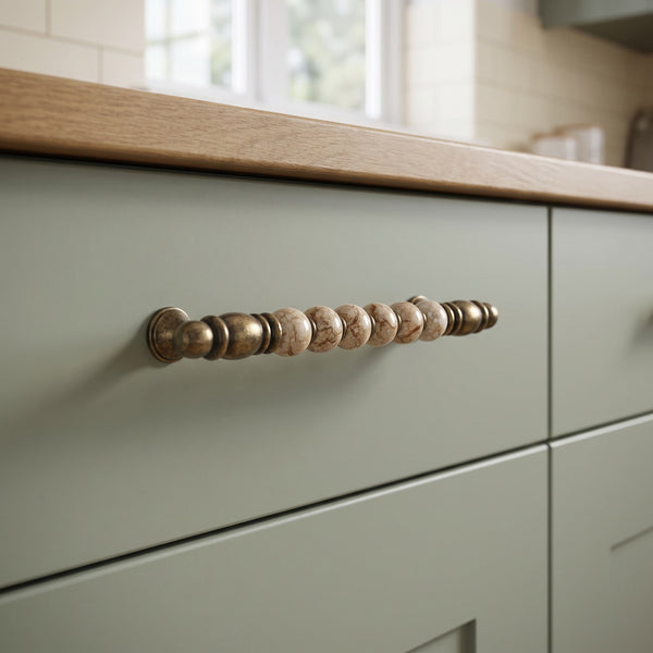 Odessa Globe Bar Handle in BROWN+AB, 192mm, fitted on a kitchen drawer
