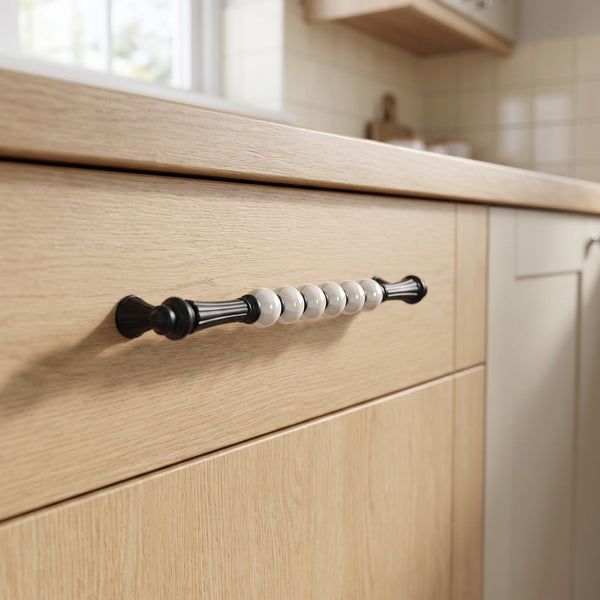 Bellora Curved Dome Bar Handle in Black+Pearl, 224mm, fitted on a kitchen drawer