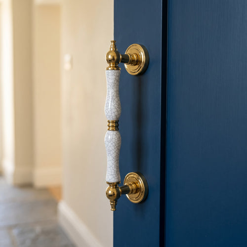 Ardenza Ceramic Door Pull Handle in PVD+Cracked Ceramic, fitted on a door
