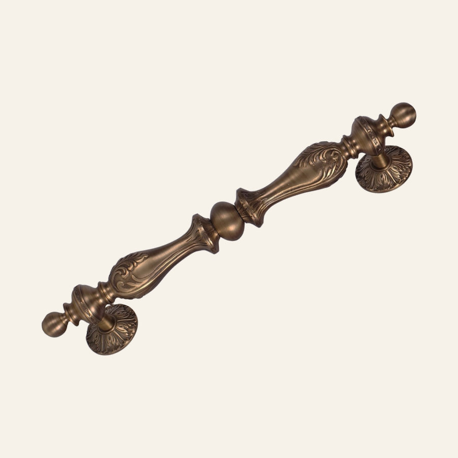Dragos solid brass pull handle, leaf-cast baluster with centre ball