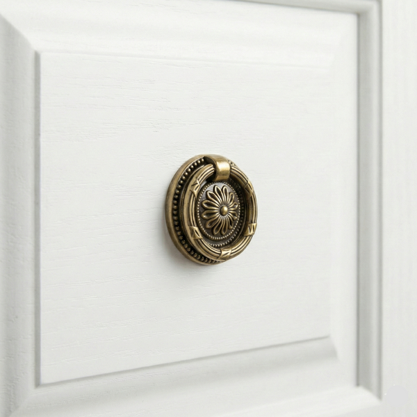Ionic Round Knob in Antique Brass