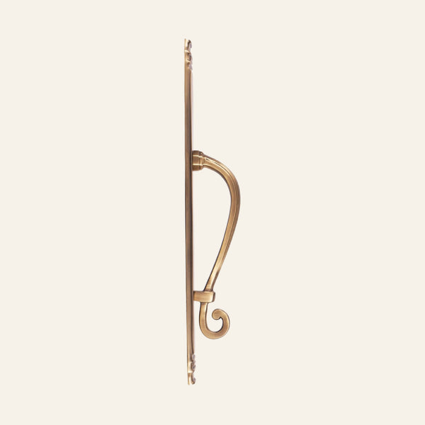 Tokyo scroll solid brass pull handle on slim reeded plate